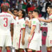 DOHA, QATAR - DECEMBER 03: Akram Afif of Qatar celebrates with teammates after scoring their team's first goal during the FIFA Arab Cup Qatar 2021 Group B match between Oman and Qatar at Education City Stadium on December 03, 2021 in Doha, Qatar. (Photo by Oliver Hardt - FIFA/FIFA via Getty Images)